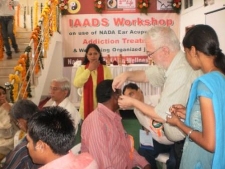 Administering acupuncture detox treatments in India